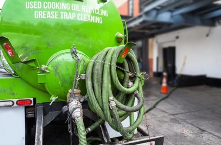a greasy liquid being sucked out of a containment system in Oxford